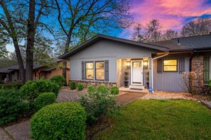 Sunset view of the front of townhome.