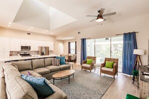 Open concept great room open to kitchen, dining and lanai