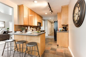 Kitchen with bar seating for 3 in Union Woods home