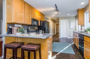 Kitchen with bar in Union Cove home