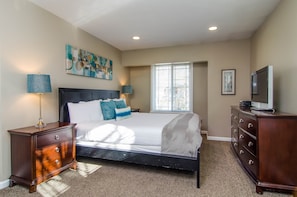 Master bedroom with king bed in Union Cove home