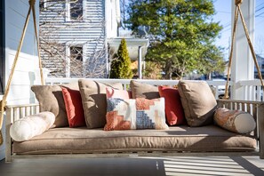 Enjoy your morning cup of coffee on the porch swing!