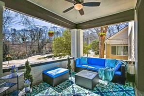 The front veranda will entice you to come outdoors and lounge on the comfy sofa.