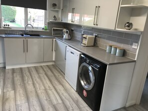 Kitchen with tea, coffee and sugar provided plus coffee pods