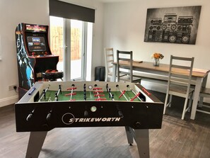 Games room with foosball and arcade gamed