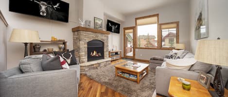 Bear Trail - a SkyRun Winter Park Property - Our living room features two TVs and plenty of seating.