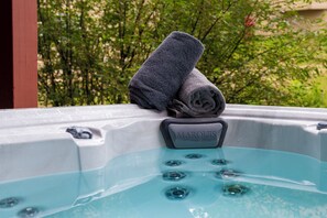 Unwind in our private outdoor hot tub after a day on the mountain