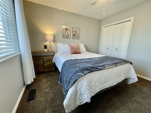 Bedroom 2 with queen bed, near bathroom 2.