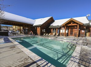 Winter view of clubhouse heated pool and outdoor heated hot tub.