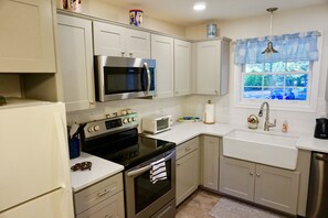 Newly renovated kitchen with quartz countertops.