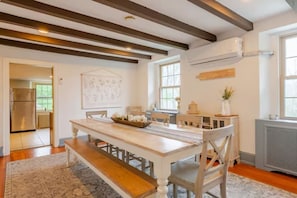 The 8-person dining table includes a bench and 5 chairs.