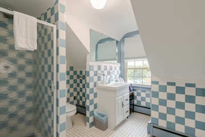 The second bathroom is light-filled and offers an amazing view outside.