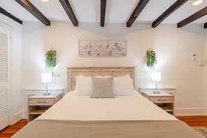 First floor primary bedroom.  All beds in the home are dressed with crisp, clean bed linens for your ultimate comfort.