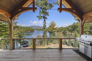 Main level patio with Weber BBQ grill and panoramic lake and mountain views