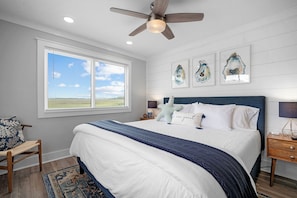 The bedroom offers a king bed, comfy linens, and one of TWO different views of the marsh!