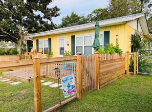 Driving into Bayview.  Welcoming front porch and fenced yard.