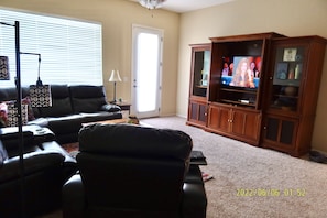 Living room view of 44 inch TV and door to back patio