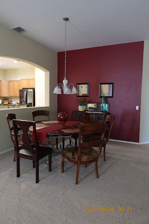 Separate dining room with a pass-through window to the kitchen