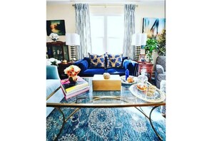 Newly decorated, cozy Living Room Salon open to kitchen and breakfast nook. 