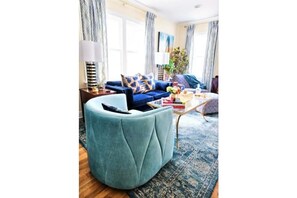New luxury swivel chair in the Living Room Salon to the left of the front door. 
