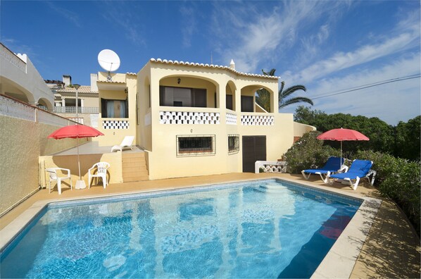 Private pool with sun loungers on the terrace