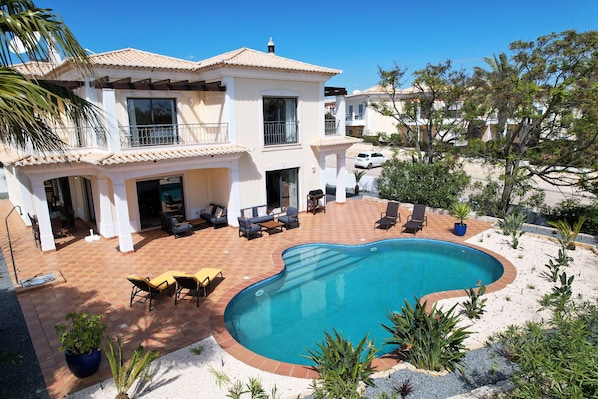 Terrace of Villa Minamar with adjacent pool