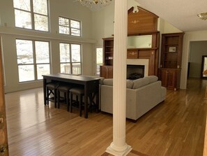 Living area with windows overlooking a waterfall