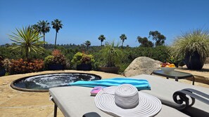 Soak in ocean & garden views from your private hot tub & lounging deck