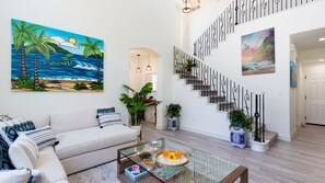 Bright and airy living room with contemporary tropical artwork