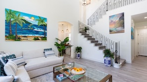 Bright and airy living room with contemporary tropical artwork