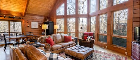 Stoney Brook Cabin Great Room with Wood Floors, Vaulted Ceilings, Wall of Windows framing Mountain Views!