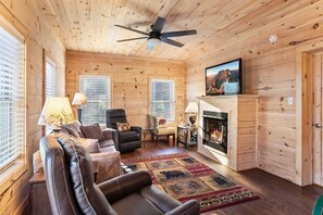 Light Tongue and Groove with Warm Wood Floors, Gas Fireplace and TV
