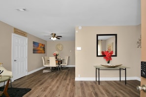 Spacious living area when you first enter the house. Very appealing to the eye.