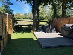 Garden with deck, furniture and BBQ