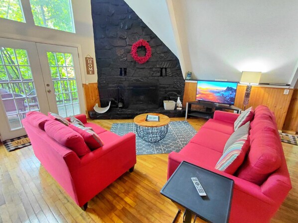 Main Floor Living Room with Roku TV and Wood Burning Fireplace