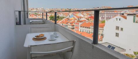 The perfect spot for a cup of coffee or an intimate dinner with a view! #airbnb #airbnblisbon #portugal #pt #lisbon #balcony #city #view