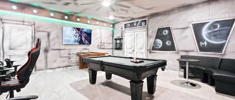 Game Room: Exciting space with a pool table and foosball setup.
