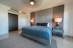 Master suite with king bed and TV