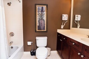 Bathroom has tub-shower combo