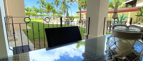 Patio is steps from the saltwater pool and steps to the ocean.