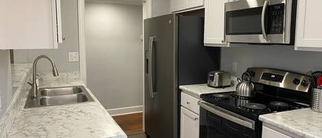 fully renovated kitchen with stainless appliances