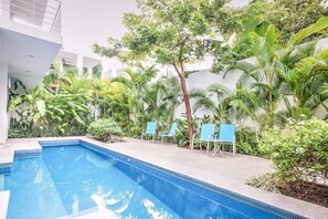 Shared pool area with grill in small boutique property.