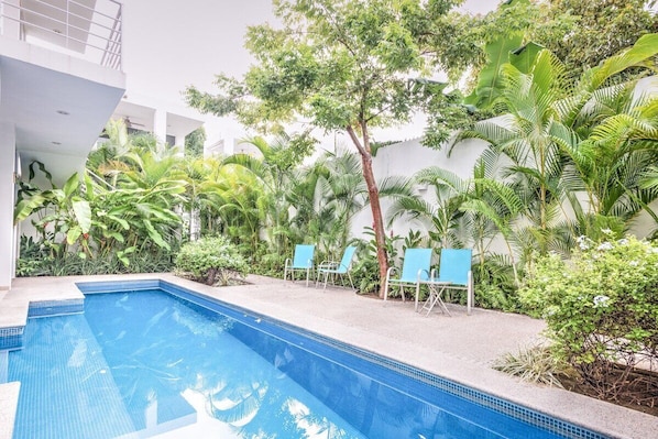 Shared pool area with grill in small boutique property.
