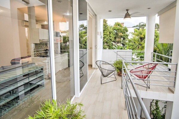Private balcony with a comfortable seating area.