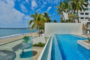 Infinity swimming pool, direct beach access, a grill area, and a private beach area with palapas for guest use only. 