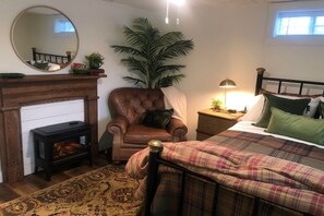 The Green Room. Leather chair. Comfy bed.