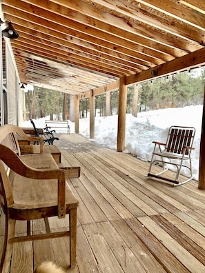 Sit and relax on the spacious back porch after a day of exploration!