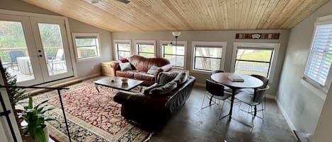 Bonus room with smart TV, game table with games and puzzles, desk area