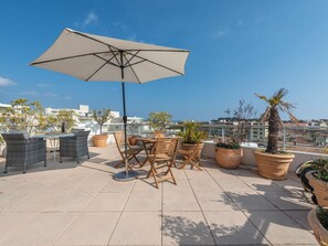 Sky, Plant, Flowerpot, Building, Umbrella, Table, Shade, Outdoor Furniture, Outdoor Table, Lighting