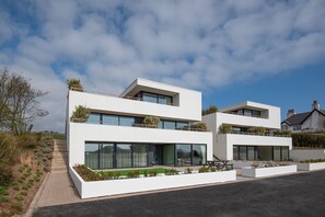 1 The Bay, Coldingham - front aspect of the three-storey detached villa, in which 1 The Bay offers a spacious garden apartment